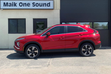Red 2024 Mitsubishi Eclipse Cross with dark privacy window tint